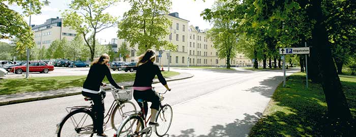 Students on bikes on their way to the university.